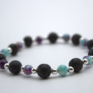 Woman's lava, silver, and jasper bracelet