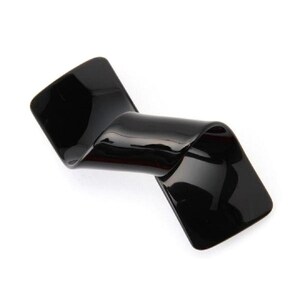 May include: A glossy black hair clip with a unique, curved design. The clip has a rectangular shape on each end, connected by a smooth, wave-like center. The surface reflects light, highlighting its sleek, modern aesthetic.