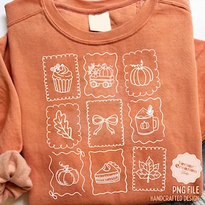 May include: Rust-colored sweatshirt with white line drawings of fall-themed images, including pumpkins, a cupcake, and a slice of pie. The design is arranged in a grid pattern. The words "PNG FILE" and "HANDCRAFTED DESIGN" are visible.