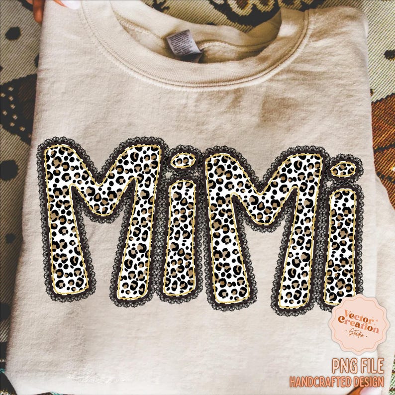 May include: A beige sweatshirt with the word "MIMI" in large, bold letters. The letters are filled with a leopard print pattern and outlined with black lace. The design includes a small pink logo and the text "PNG FILE HANDCRAFTED DESIGN".