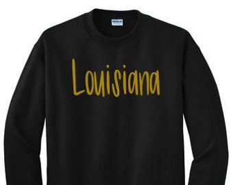 black sweatshirt with gold writing