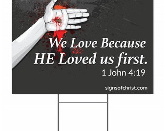 We love because he loved us first yard sign