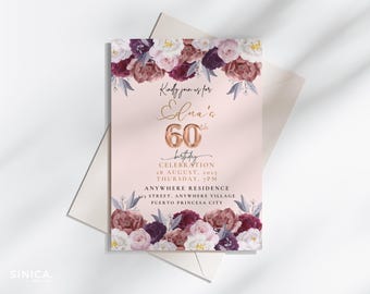 May include: A blush pink 60th birthday invitation with floral accents. The invitation features the text "Kindly join us for Elna's 60th birthday celebration" in gold script. Floral arrangements in burgundy, white, and mauve adorn the top and bottom.