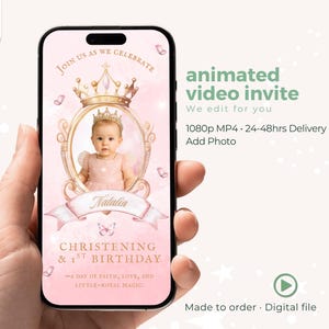 May include: A smartphone displays a pink animated video invite for a christening and 1st birthday. The invite features a baby in a crown, the name "Natalia", and the text "Join us as we celebrate". The video is a digital file.