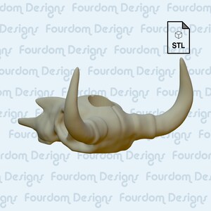 K&ouml;nnte beinhalten: Ein 3D-gedrucktes Modell eines Bullensch&auml;dels mit einem Loch oben. Der Sch&auml;del ist beige und hat eine glatte Oberfl&auml;che. Das Modell ist im STL-Format zum Download verf&uuml;gbar.