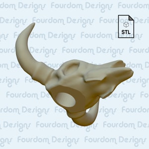 K&ouml;nnte beinhalten: Ein 3D-gedrucktes Modell eines Bullensch&auml;dels mit einem Loch in der Mitte. Das Modell ist beige und hat eine strukturierte Oberfl&auml;che. STL.