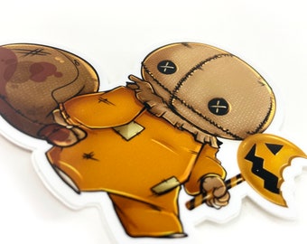 May include: A cartoon illustration of a stitched-faced character wearing a brown sackcloth costume and holding a candy corn lollipop. The character is running and has a brown sack on its back.