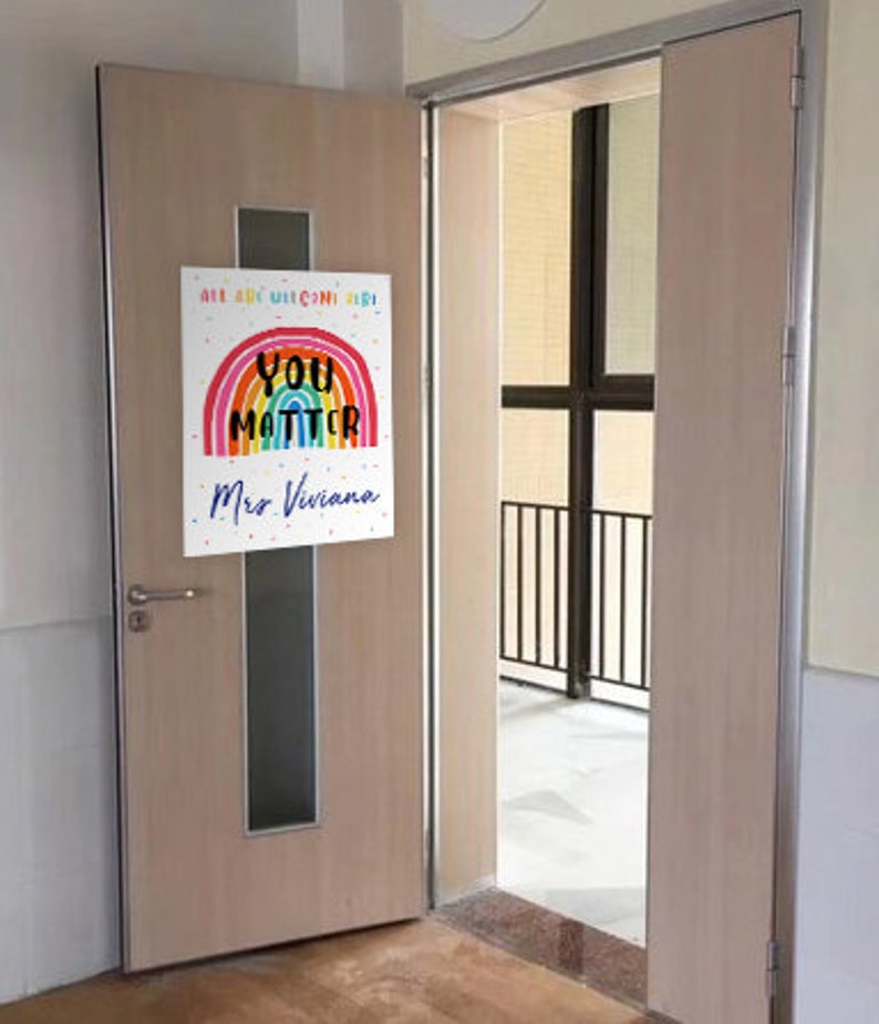 May include: A rainbow-colored poster with the text "You Matter" and "All are welcome here!"  The poster also includes the name "Mrs. Viviana".