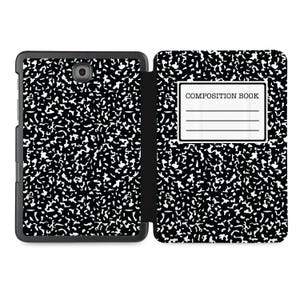 May include: Black and white composition book style tablet case with a flap cover. The cover has the words "Composition Book" printed on it.