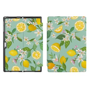 May include: A green and white tablet case featuring a lemon and flower design. The case is made from a durable material and has a slim design.