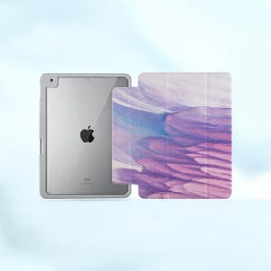May include: A purple and blue abstract design iPad case with a white background. The case is shown closed with the iPad screen visible.