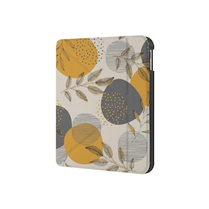Könnte beinhalten: Ein beigefarbenes Etui mit einem Muster aus gelben und grauen Kreisen und schwarzen Blattdesigns. Das Etui hat einen schwarzen Rand.