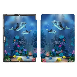 May include: A blue and black tablet case featuring a design of dolphins swimming in an underwater scene with coral reefs and fish. The case has a flap that covers the screen.