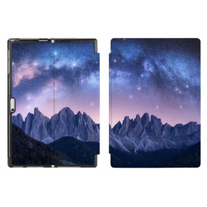 May include: A tablet case featuring a starry night sky and mountain range design. The case is made from a durable material and has a sleek, modern design.