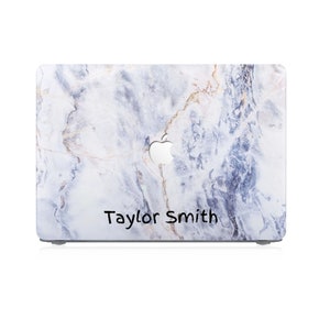 May include: A white laptop case with a blue and gold marble pattern. The case has a cutout for the Apple logo and the name "Taylor Smith" is written on the bottom.
