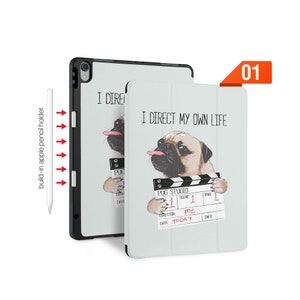 May include: A white iPad case with a pug dog illustration holding a clapperboard. The case has the text "I direct my own life" and "Pug Studio" printed on it. The case has a built-in Apple Pencil holder.