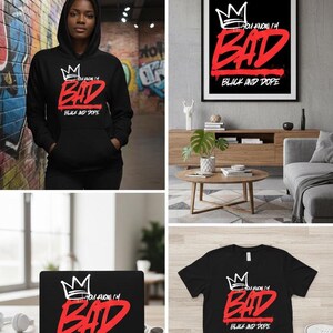 May include: Black hoodie with the text "YOU KNOW I'M BAD BLACK AND DOPE" in white and red. The design includes a crown graphic. Also shown are a black t-shirt, a framed print, and a laptop with the same design.