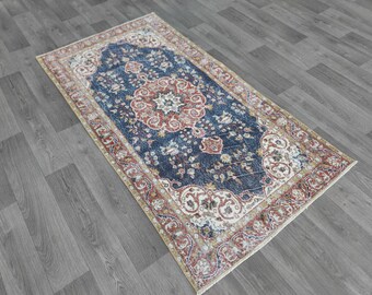 May include: A blue, red, and cream patterned rug with a floral design. The rug has a traditional Persian style.