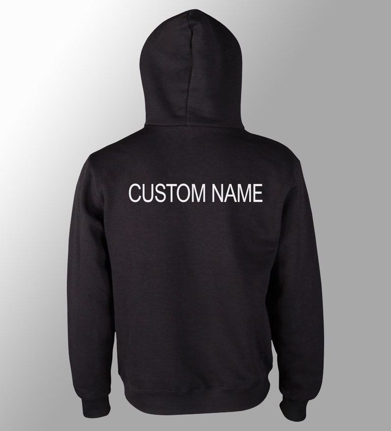 May include: Black hooded sweatshirt with the text "CUSTOM NAME" printed in white on the back.
