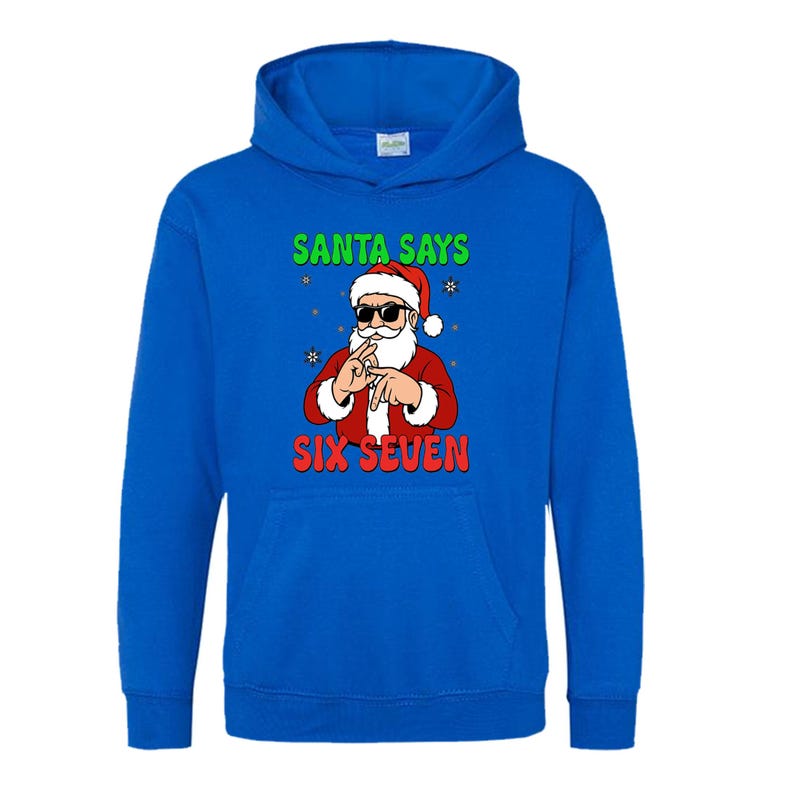 May include: A blue hooded sweatshirt featuring a graphic of Santa Claus wearing sunglasses and making a hand gesture. The text "SANTA SAYS" is above the Santa graphic, and "SIX SEVEN" is below.