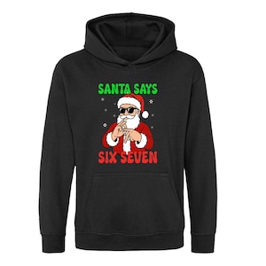 May include: Black hooded sweatshirt with a graphic of Santa Claus wearing sunglasses and making a hand gesture. The text "SANTA SAYS" is above the Santa graphic in green, and "SIX SEVEN" is below in red.