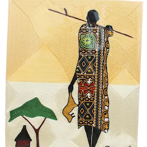 May include: An embroidered artwork depicts a silhouetted figure in traditional African attire, carrying a spear and a yellow object. The background features a tree, a hut, and geometric patterns in yellow and white. The artwork is signed "Edmant".