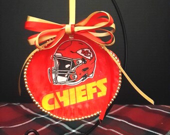 Chiefs-themed shell with a stand