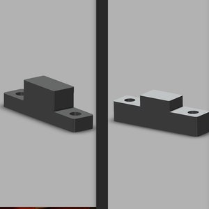 Könnte beinhalten: Vier schwarze Kunststoffabstandshalter in verschiedenen Größen. Die Abstandshalter sind rechteckig mit einer erhöhten Plattform in der Mitte.