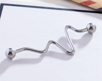 May include: Silver body jewelry with a wavy design and two round balls on each end.