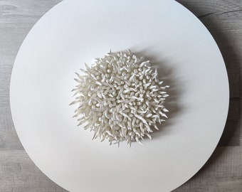 Spiky round wall sculpture on a 20" diameter canvas, wreath art, white clay wall art, relaxing wall art, contemporary art