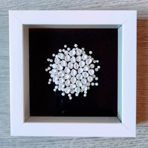 Framed black and white bookshelf decor, white on black wall art, small clay wall sculpture, abstract textured art, minimalistic art