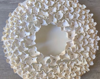 White Clay Floral Wall Sculpture on Round Canvas.