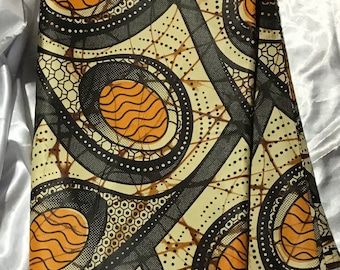 African Print Fabric, with Orange, green, beige tones and pattern
