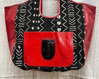 Leather Hand Bag, red, adorned  mud cloth, wood figures, zippers in back and insidelined with African Fabric measurements in description