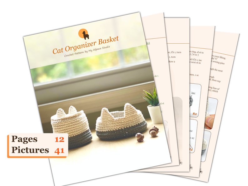 May include: A crochet pattern for a cat-shaped organizer basket. The pattern includes 12 pages and 41 pictures. The image shows two finished baskets, one in beige and gray, and the other in white and gray.