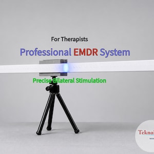 May include: A white Professional EMDR System for therapists, mounted on a black tripod. The device features a long, rectangular light bar with the text "Precise Bilateral Stimulation". The image also includes the website address teknologicEMDR.org.