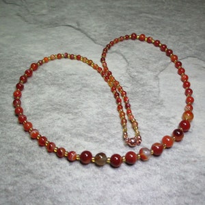 Graduated Necklace Of Orange Veined Agate