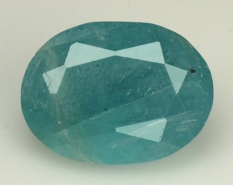 May include: A light blue oval-shaped gemstone with a faceted cut.
