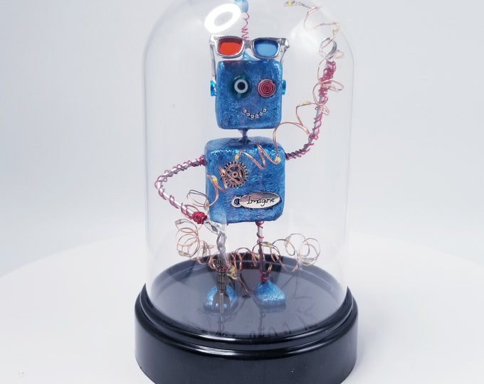 Retro robot with 3D glasses, blue robot in plastic display dome