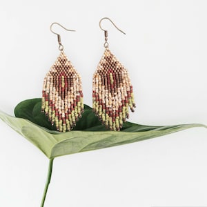 Tylane | Mid-length ethnic style earrings. Turquoise blue or green, bronze, cream, brick red colors