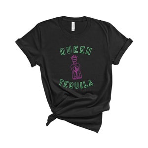 May include: Black t-shirt with a green outline of the text "Queen Tequila" and a pink outline of a tequila bottle with a crown on top.