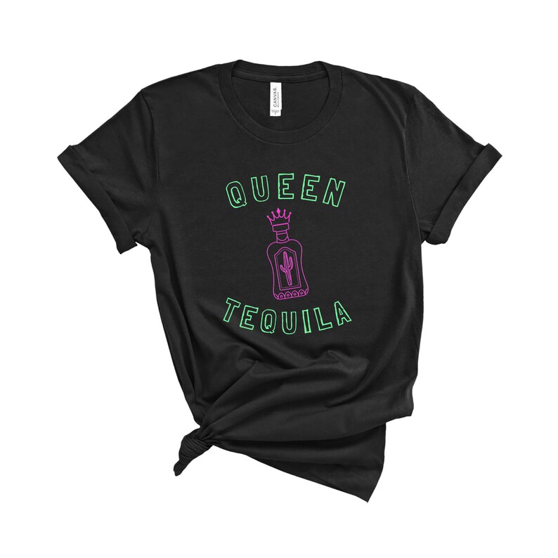 May include: Black t-shirt with a green outline of the text "Queen Tequila" and a pink outline of a tequila bottle with a crown on top.