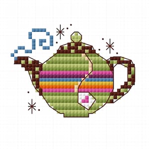 May include: Cross-stitch design of a teapot with a green body, brown accents, and a rainbow stripe. The teapot has a small tea bag and steam rising from the spout. Decorative starbursts surround the teapot.