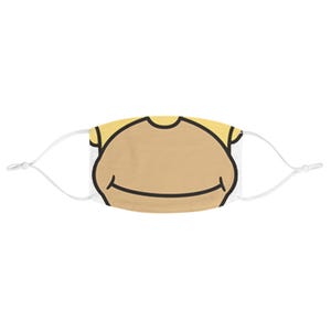 May include: A white face mask with a yellow and brown cartoon face printed on it. The face has a simple smile.