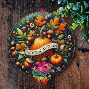 May include: A round, colourful illustration of an autumn scene with pumpkins, acorns, and leaves. The text "Welcome Autumn" is written on a banner.