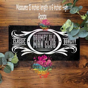 May include: A black metal sign with white text that reads "GRUMPY OLD MAN CLUB." The sign measures approximately 30 cm in length and 15 cm in height. The words "CLASSIC" and "QUALITY" are also displayed.