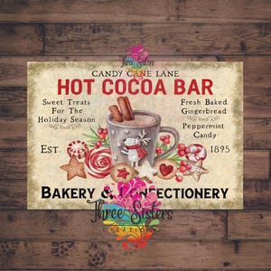 May include: A vintage-style sign for a Hot Cocoa Bar, featuring a mug of cocoa with a reindeer, gingerbread cookies, and candy canes. The sign includes text that reads "Candy Cane Lane" and "Bakery & Confectionery."
