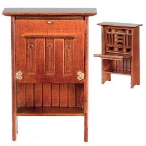 May include: A wooden secretary desk with a drop-down front and a shelf. The desk is made of dark wood with a light wood trim. It has a carved design on the front and brass accents.