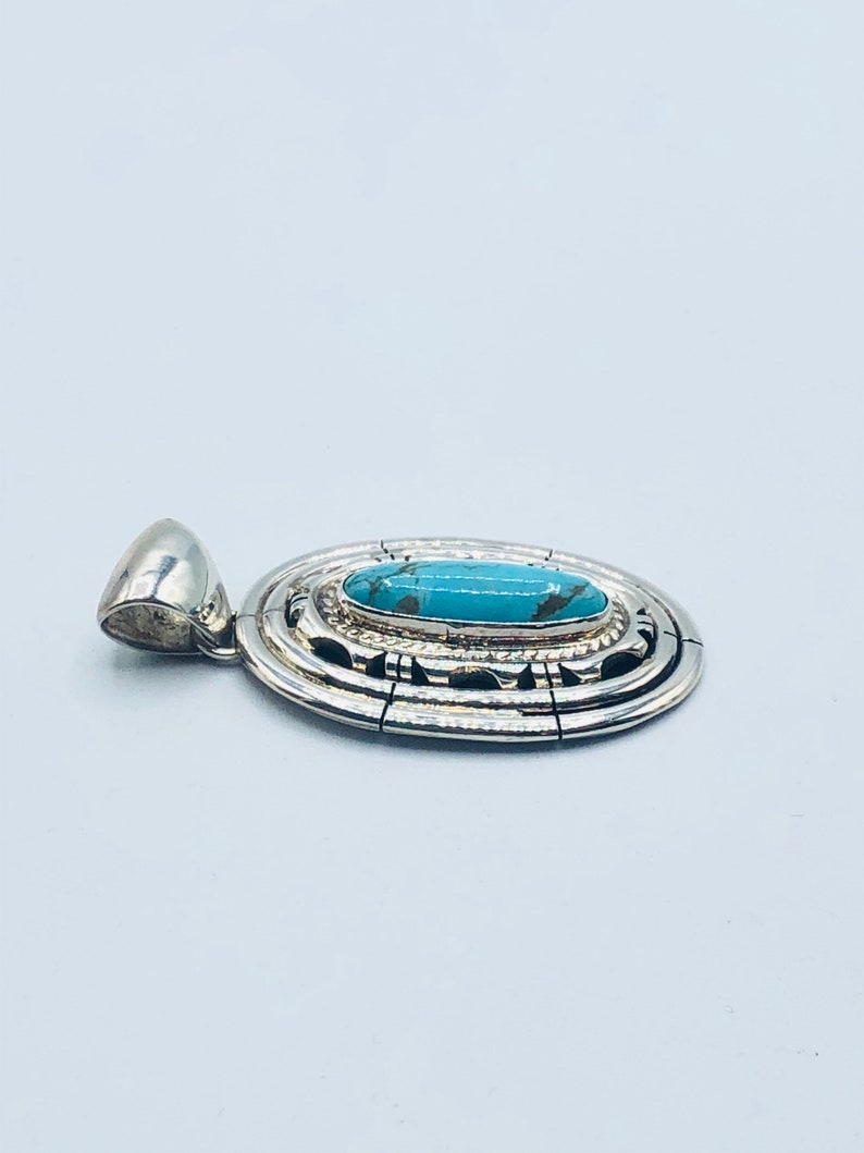 Native American Navajo handmade sterling silver turquoise pendant