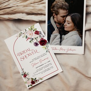 May include: A white bridal shower invitation with a burgundy and pink floral arch design. The invitation includes the text "Bridal Shower", "Please join us for a bridal shower honouring Selina Denvers", "September 14 4PM", "The Wilson Residence", "14 Pine Street, Atlanta, GA", "RSVP to Sally at 894-968-7643 by 1st September". A Polaroid photo of a couple is in the background with the text "Future Mrs. Johnson".